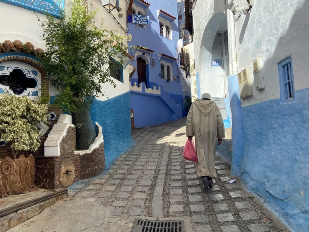 Explore the picturesque blue architecture of Chefchaouen's narrow cobblestone alleyways.