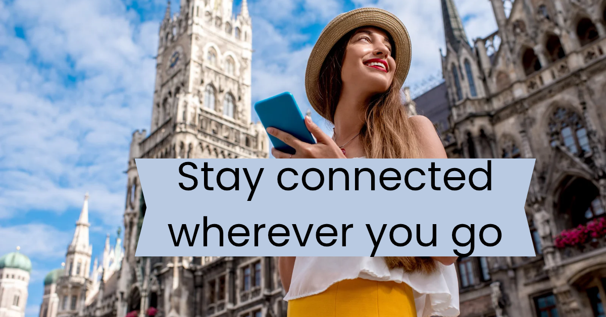 Woman smiling with smartphone outdoors looking for esim.