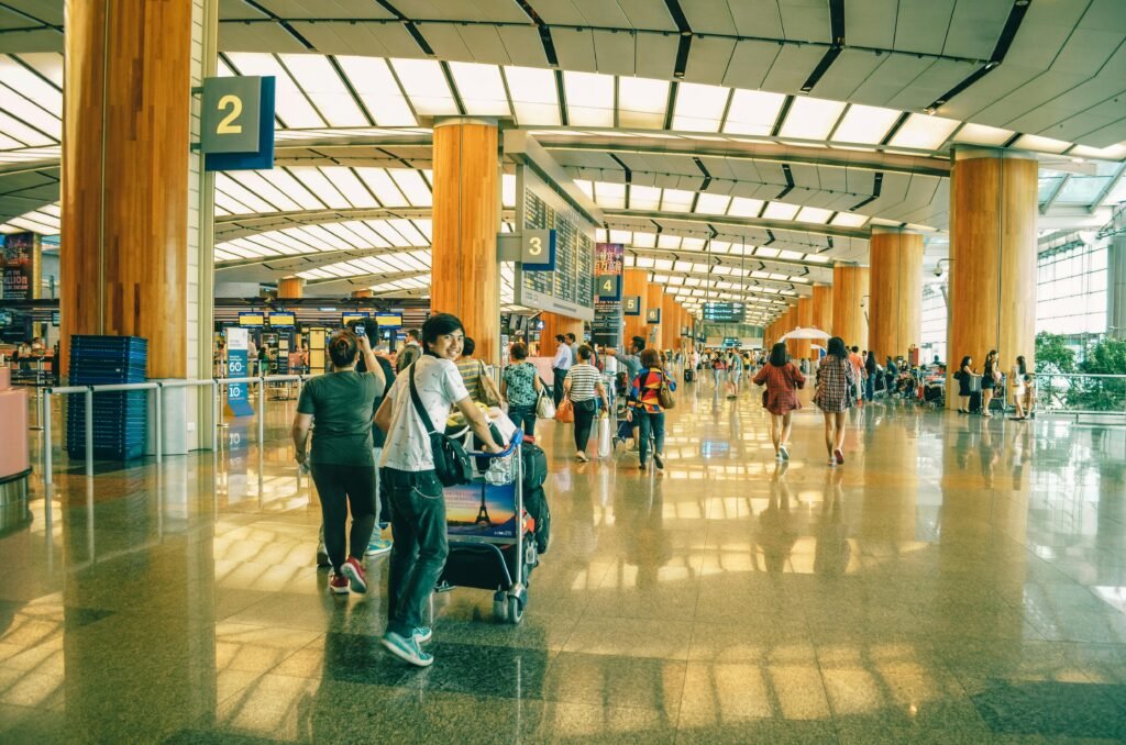 Heathrow Airport terminal interior with moving walkway and passenger areas