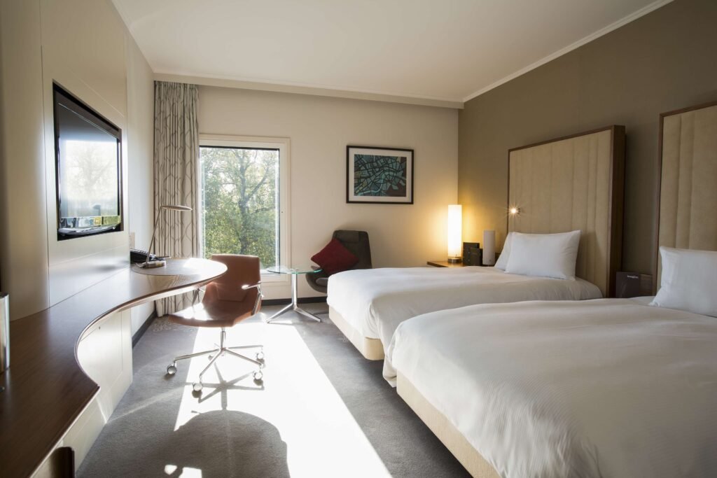 Modern hotel room with twin beds in Hilton London Heatrow Airport