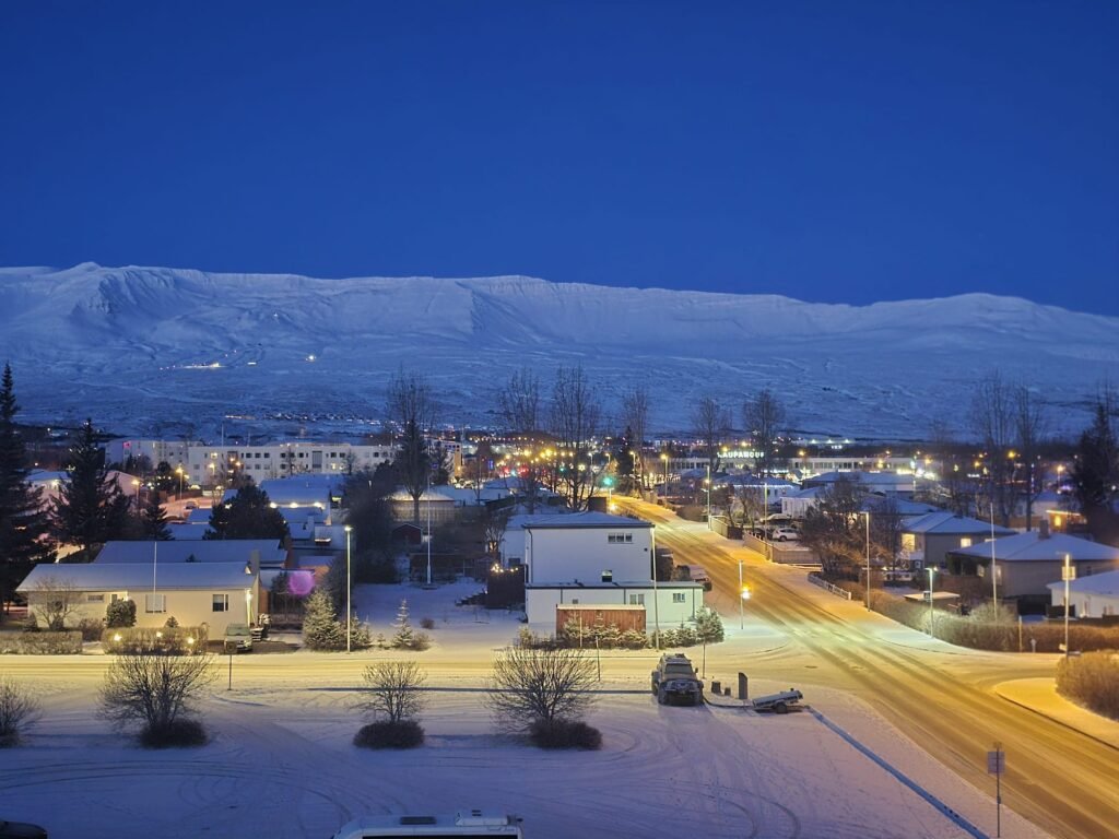 Snowy town under a twilight sky in Akureyri