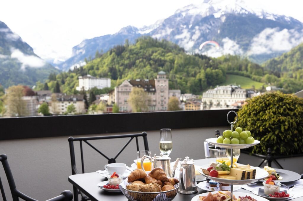 Breakfast table with mountain backdrop in Swizerlad