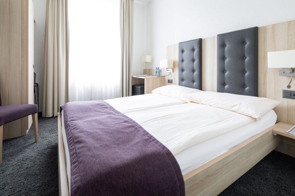 Modern hotel room with double bed