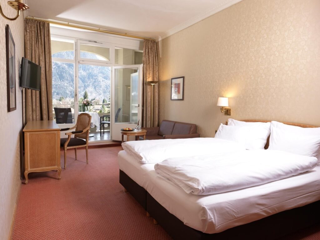 Spacious hotel room with balcony view