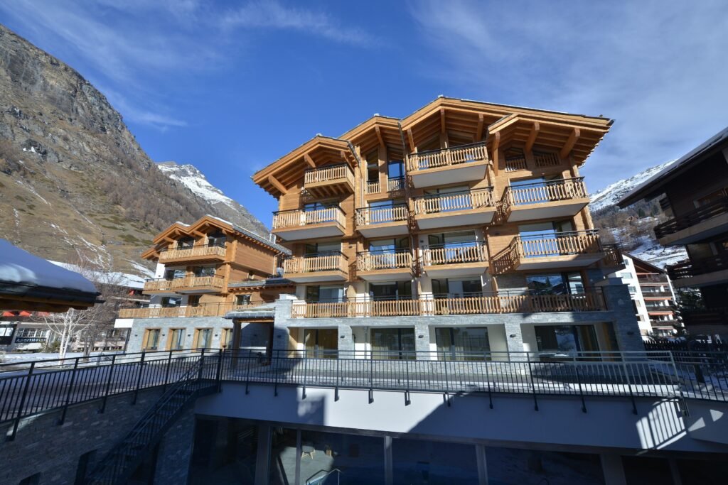 Modern chalet in mountainous landscape.