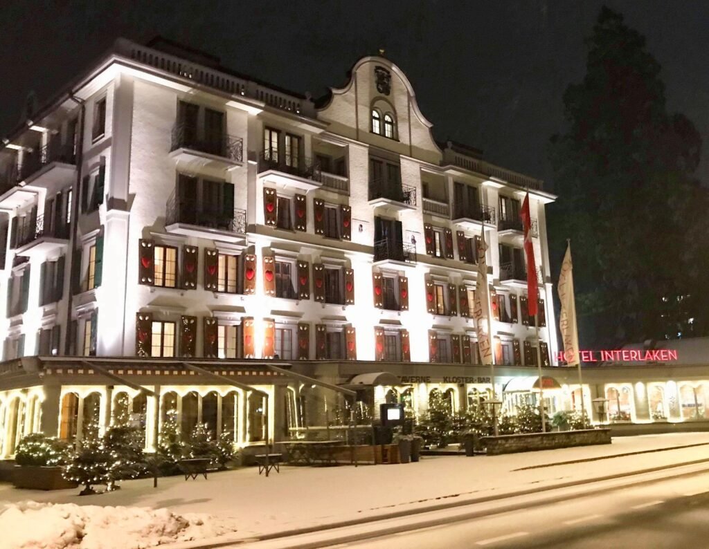 Illuminated hotel in snowy landscape hotel Interlaken