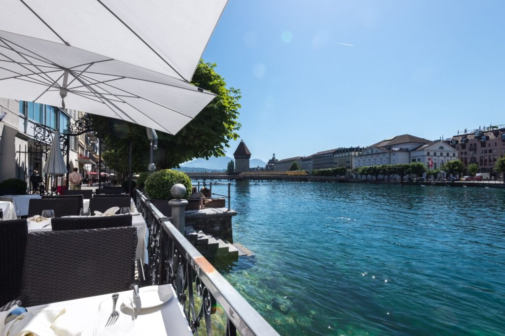 Sunny lakeside dining with umbrellas