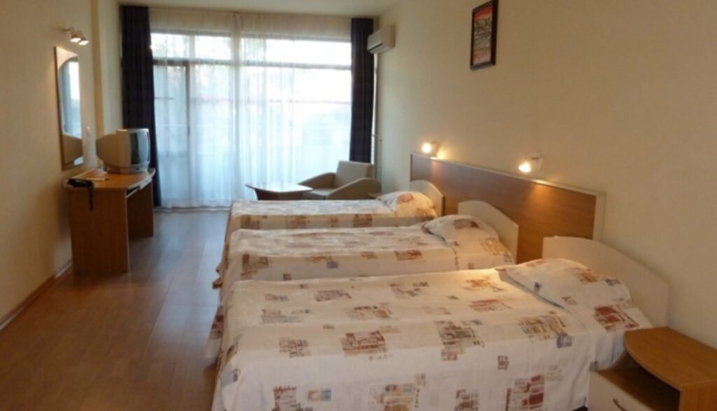Hotel Avenue Sunny Beach twin room with simple decor and balcony access